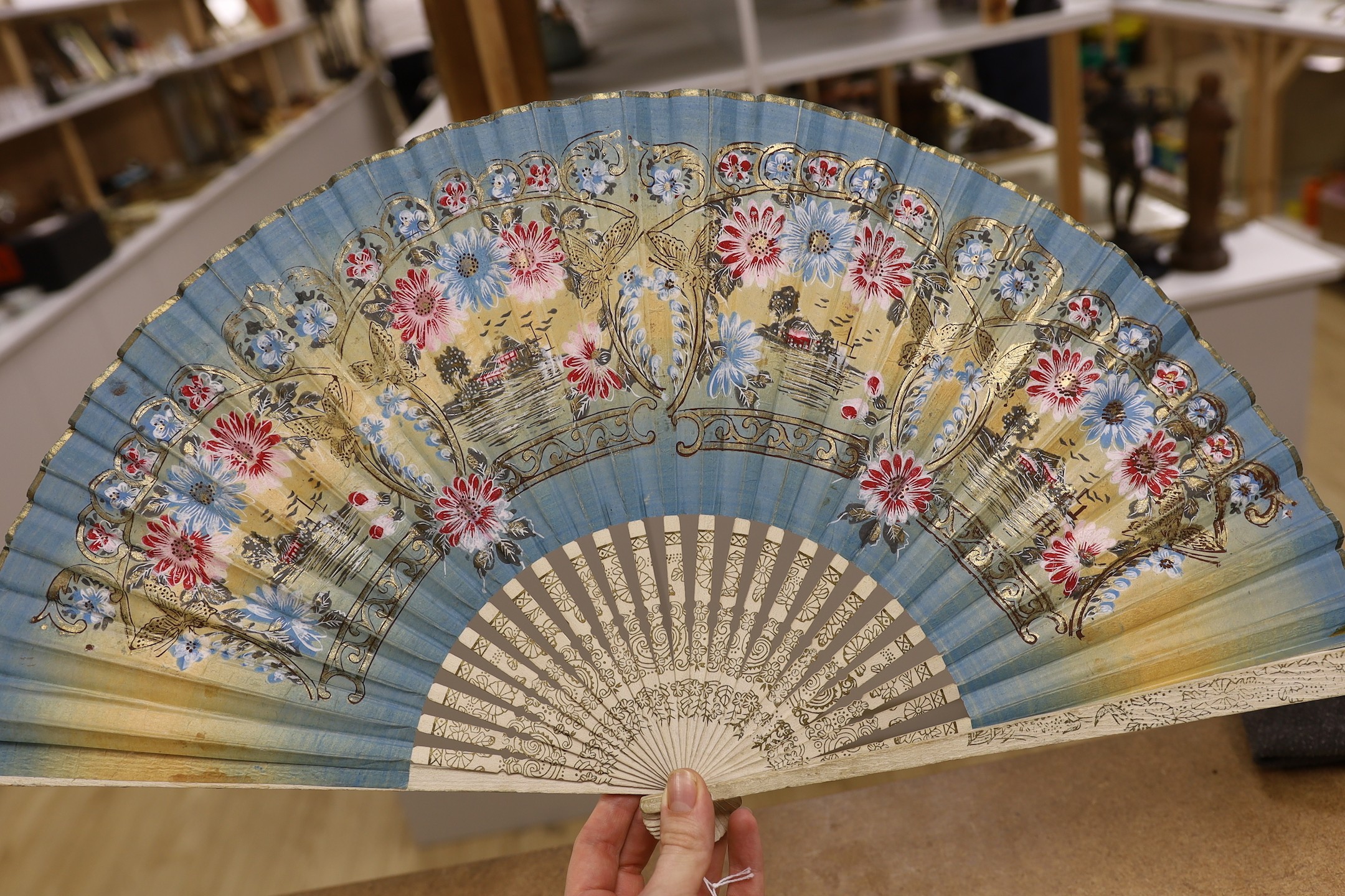 An unusual 19th century feather fan, three sequin and gauze fans, a paisley fan, Sandalwood fan and a collection of later fans and stick guards, feather fan 33cms high